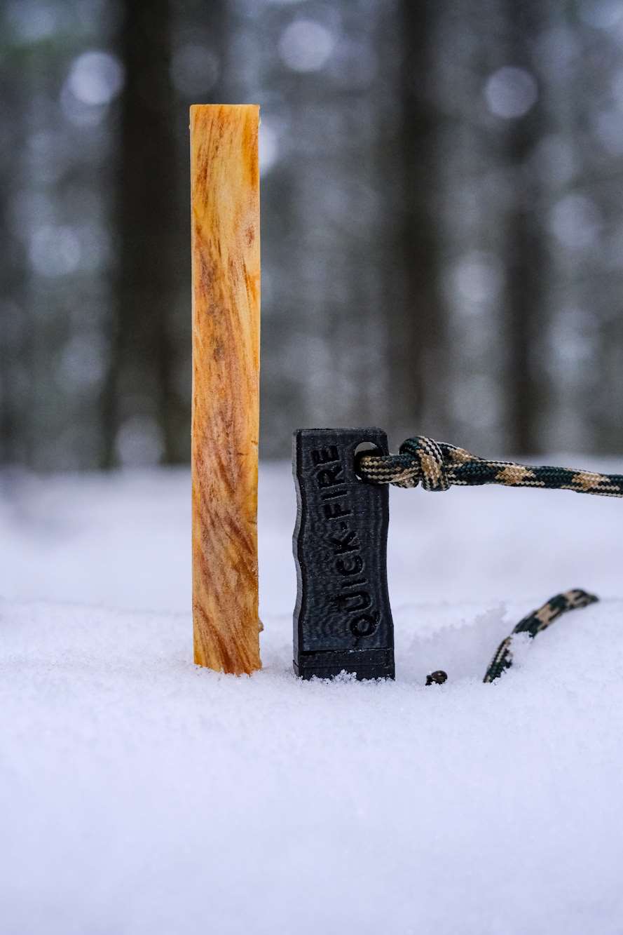 one-fatwood-stick-black-case-Compact-Reliable-QUICK-FIRE-Striker-with-multicolor-paracord-tall The Reliable, Compact QUICK-FIRE Striker with a black and white paracord strap.